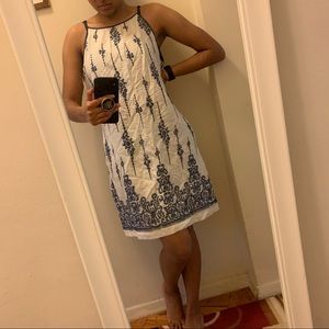 Sleeveless summer tea dress with high neck